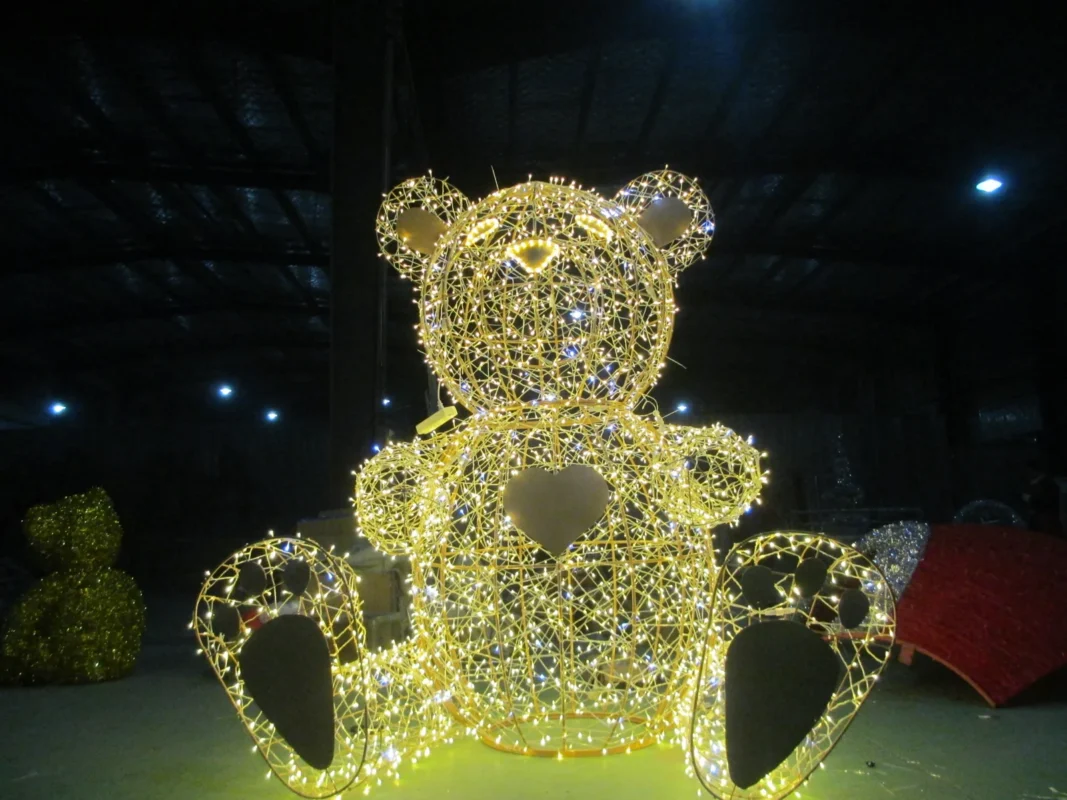 A bear-shaped decorative light form shown in the workshop.