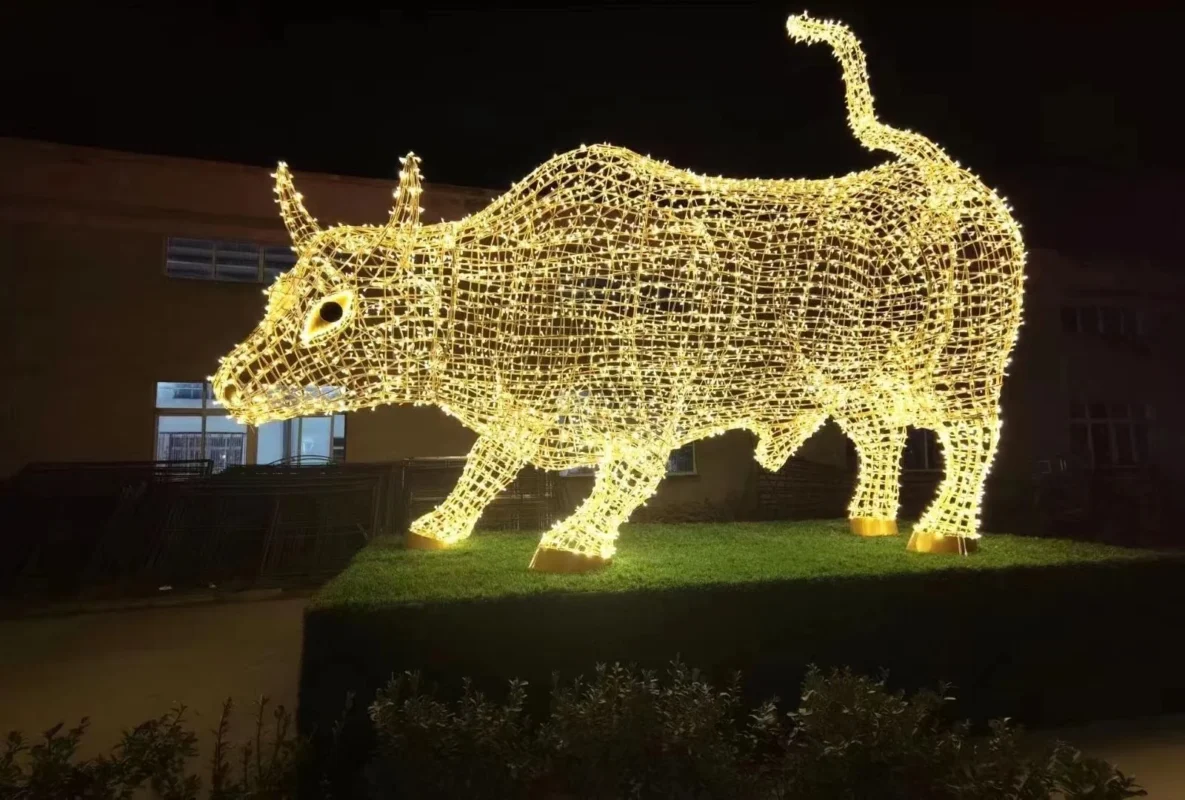 An illuminated bull-shaped decorative light form.