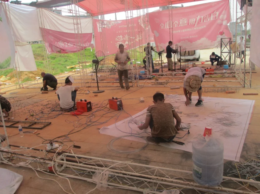 Display sections being prepared in a temporary on-site work area.