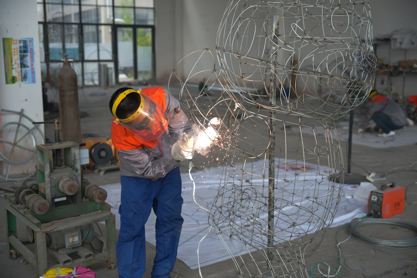 A wider view of framework fabrication in the workshop.