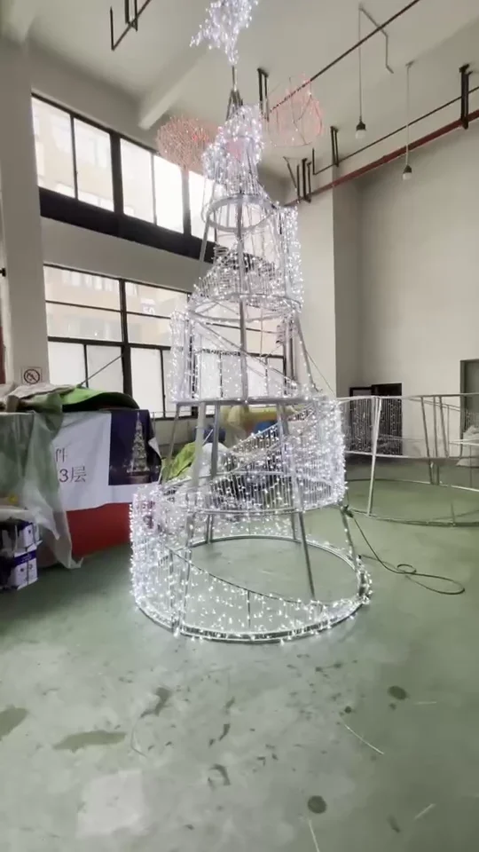 An illuminated reindeer light form in the workshop.